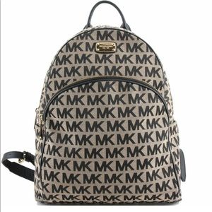 Authenticated Micheal Kors signature Abby large backpack
